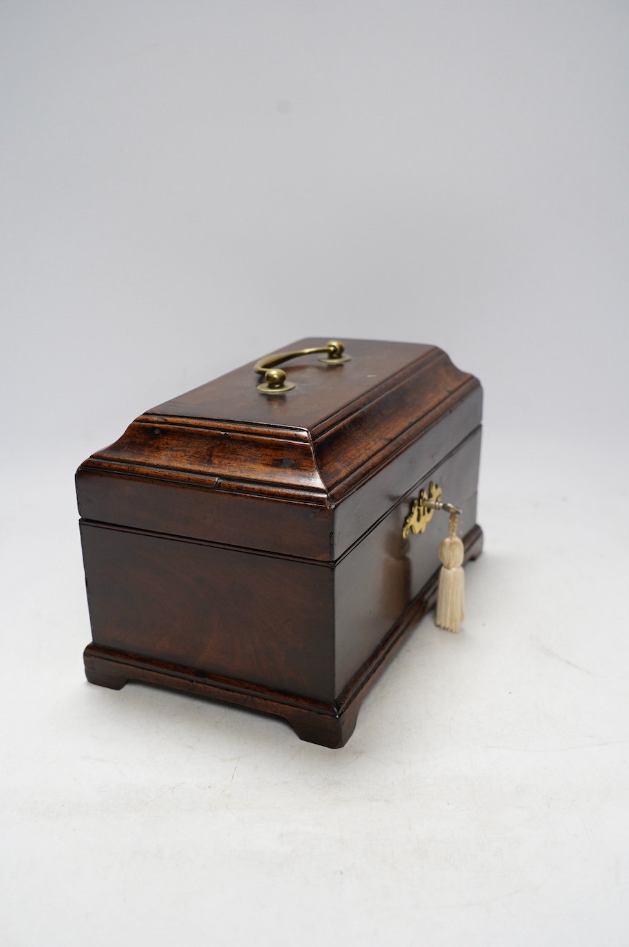 A George III mahogany tea caddy, 25cm wide. Condition - fair